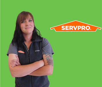 woman in front of SERVPRO logo